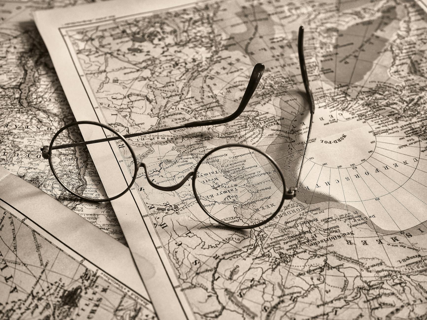 eyeglasses on paper maps
